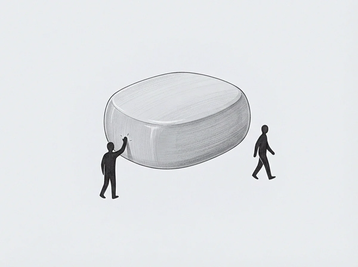One figure reaches out to contact a large smooth monolith while a second figure departs from the structure on a plain grey field.